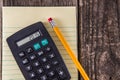 Yellow Tablet Pencil & Calculator on Vintage Desk Royalty Free Stock Photo