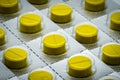 Yellow tablets pill in blister pack. Full frame of tablet pills