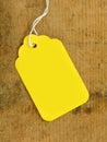 Yellow Tag on Wood Royalty Free Stock Photo