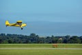 Yellow tail dragger airplane landing