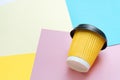 Coffee cup on colored paper