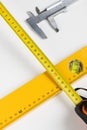 Yellow spirit level and caliper Royalty Free Stock Photo