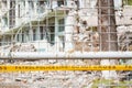 Yellow tape with Police line Do not cross inscription in front of destroyed building Royalty Free Stock Photo