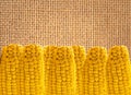 Yellow tasty corn over linen texture Royalty Free Stock Photo