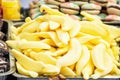 Yellow tasty licorice candies in plastic container