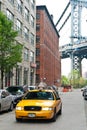 Yellow taxi in Brooklyn daylight scene