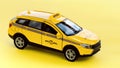 Yellow taxi cab on a yellow background macro photography. Taxi car side view. Service for getting around the city by taxi. Taxi Royalty Free Stock Photo