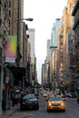 Yellow taxi cabs ride on 5th Avenue in New York City, USA Royalty Free Stock Photo