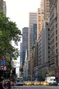 Yellow taxi cabs ride on 5th Avenue in New York City, USA Royalty Free Stock Photo