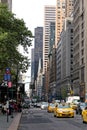 Yellow taxi cabs ride on 5th Avenue in New York City, USA Royalty Free Stock Photo