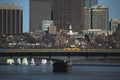 Yellow Taxi drives across Harvard Bridge over Charles River with Colorful sailboats, Boston, Massachusetts, USA