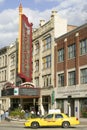 Yellow taxi drives by Providence Performing Arts Center marquee sign, Providence, Rhode Island