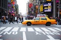 Yellow taxi in intersection, New York City, NY