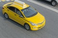 Yellow taxi moves on the city Royalty Free Stock Photo