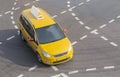 Yellow taxi moves on the city Royalty Free Stock Photo