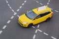 Yellow taxi moves on the city Royalty Free Stock Photo