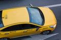 yellow taxi moves on the city Royalty Free Stock Photo