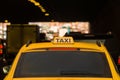 Yellow taxi moves in the midst of cars along city streets. Royalty Free Stock Photo