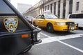 Yellow taxi and Nypd vehicle in Manhattan Royalty Free Stock Photo