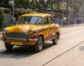 Yellow Taxi riding on street in Kolkata Royalty Free Stock Photo