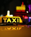 Yellow taxi sign on car roof Royalty Free Stock Photo