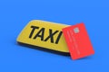 Yellow taxi sign near credit card. Payment for carrier services