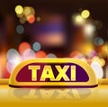 Yellow taxi sign on the roof of car in a city street. New York taxi car at night. Luminous neon taxi sign on bokeh big Royalty Free Stock Photo