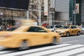 Yellow taxi on the street in New York, USA, motion blurred. Royalty Free Stock Photo