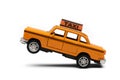 Yellow taxi toy retro car model on a white background. Isolated Royalty Free Stock Photo