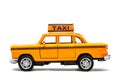 Yellow taxi toy retro car model on a white background. Isolated Royalty Free Stock Photo