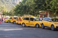 Yellow taxi in Turkey, the city of Alanya. Lots of parked taxis. Travel to Turkey.