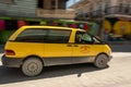 Yellow taxi van on the street of San Pedro, Belize