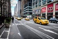 Yellow taxis passing by Jcpenney in New York City