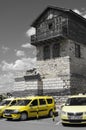 Yellow taxis and typical house in the old town of Nesebar