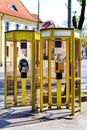 Yellow telephone booths with payphones. Bialystok