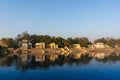 Yellow temples and buildings reflected in yamuna river at ghat in delhi