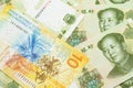 A Swiss franc bank note with Chinese one yuan bills Royalty Free Stock Photo