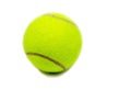 Yellow tennis ball on white background. Single felt ball with dark curve line and small shadow. Tennis game equipment Royalty Free Stock Photo