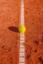 Yellow tennisball on a old court Royalty Free Stock Photo