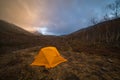 Yellow Tent and Clouds in Khibiny Mountains in Autumn Morning. Russia