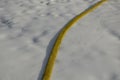 Yellow textile fire hose. it is used by ski owners to connect water to snow cannons and turbines with nozzles for the production o