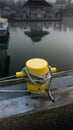 Yellow, tie-up post for docking boats Royalty Free Stock Photo