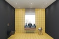 Yellow tile and black bathroom, sink and toilet