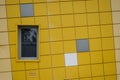 Yellow tiled facade wall