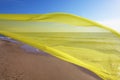 Yellow tissue flying over the sea