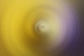 A yellow to purple radial blurred gradient background