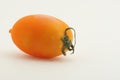 Yellow tomato against white background Royalty Free Stock Photo