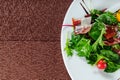 Yellow tomato, cucumber, red cabbage and watermelon radish vegetables salad. healthy raw vegan lunch bowl. Top view Royalty Free Stock Photo