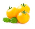 Yellow tomatoes with basil.