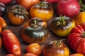 Yellow tomatoes Beauty King on an old wooden table. Collection of local tomatoes Royalty Free Stock Photo